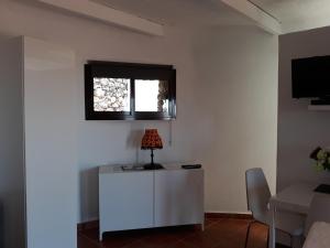 TV a/nebo společenská místnost v ubytování Loft La Tahonilla