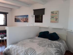 Postel nebo postele na pokoji v ubytování Loft La Tahonilla