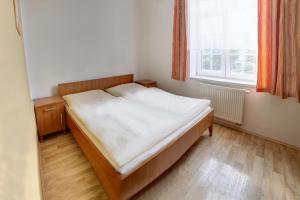 Posteľ alebo postele v izbe v ubytovaní Penzion Tillerova vila