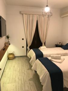 Postel nebo postele na pokoji v ubytování NIKOLETA'S CORFU APARTMENTS