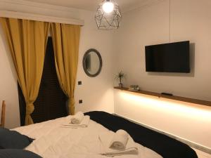 Postel nebo postele na pokoji v ubytování NIKOLETA'S CORFU APARTMENTS