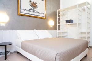 Posteľ alebo postele v izbe v ubytovaní Hotel Columbia