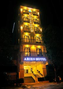 a hotel with a sign that reads atires hotel at night at Aries Hotel in Tuy Hoa