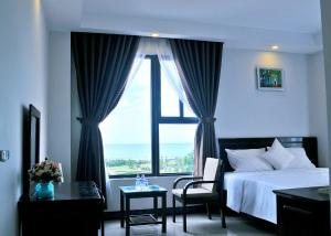 Postel nebo postele na pokoji v ubytování Aries Hotel