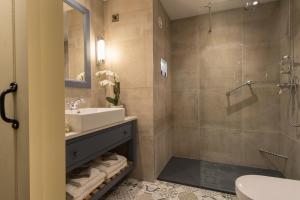 a bathroom with a sink and a shower at Bushmills Inn Hotel & Restaurant in Bushmills