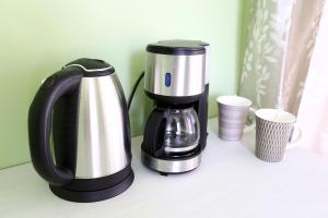 a coffee maker is sitting on a counter at Hostel Sport in Haapsalu