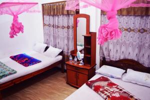 Postel nebo postele na pokoji v ubytování Subash Hotel