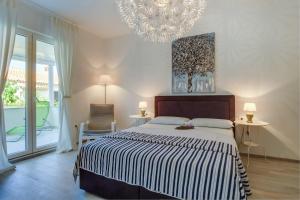 Un pat sau paturi într-o cameră la Cuore di Milka Apartments