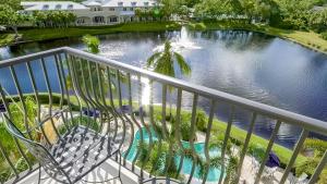 a view of a pond from a balcony at Inn at Pelican Bay in Naples