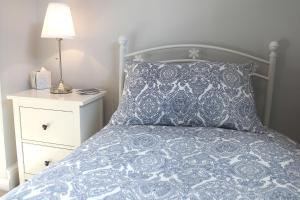 A bed or beds in a room at The Haven Ludlow