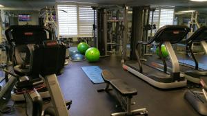 a gym with exercise equipment and exercise balls at Inn at Pelican Bay in Naples