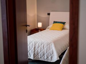 Postel nebo postele na pokoji v ubytování Hotel Metropol