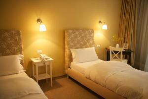 Postel nebo postele na pokoji v ubytování Hotel Vanilla