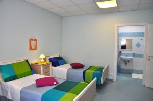 Postel nebo postele na pokoji v ubytování Albergo Rio