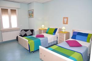 Postel nebo postele na pokoji v ubytování Albergo Rio