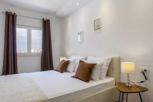 Ένα ή περισσότερα κρεβάτια σε δωμάτιο στο Villa Apartments AA 1 +69 φωτογραφίες