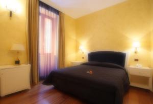 Postel nebo postele na pokoji v ubytování Hotel Rojan