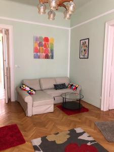 a living room with a couch and a table at Summer place in Budapest