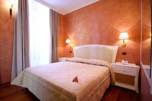 Postel nebo postele na pokoji v ubytování Hotel Rojan