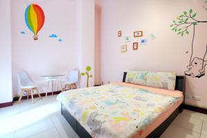 A bed or beds in a room at Good Fit Homestay