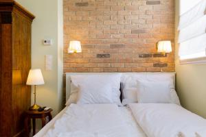 Posteľ alebo postele v izbe v ubytovaní Roland Apartments