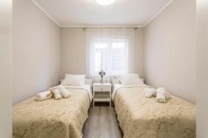 Postel nebo postele na pokoji v ubytování Luxury Apartment Beyond