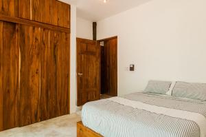 Postel nebo postele na pokoji v ubytování Jungle Chic Villa in Chemuyil