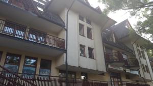 a building with balconies on the side of it at ZAKOkrywan in Zakopane