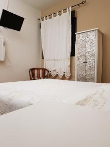 Een bed of bedden in een kamer bij Pensión Susierra