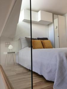 Postel nebo postele na pokoji v ubytování Jolie Apartments