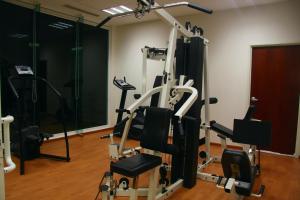 a gym with a treadmill and tread machines at Astur Hotel & Residence in Veracruz