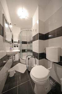 Kylpyhuone majoituspaikassa Apartment Luci