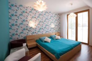 Кровать или кровати в номере Hotel Garni Pod Skalkou