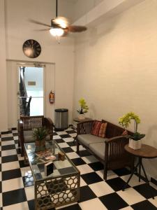 a living room with a couch and a table at Navona Studios in San Juan