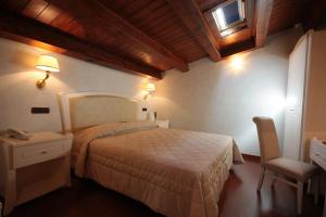 Postel nebo postele na pokoji v ubytování Hotel Rojan