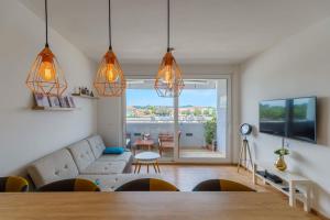 TV a/nebo společenská místnost v ubytování Apartment Skadenca