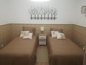 A bed or beds in a room at Isaura Henriques
