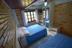 Un pat sau paturi într-o cameră la Residencial Costa Mar