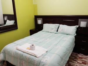 En eller flere senge i et værelse på Alojamiento Huaraz