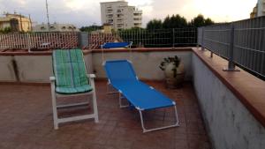 two chairs sitting on a roof at New Prophet Appartamenti in Cattolica