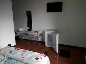 Postel nebo postele na pokoji v ubytování Hotel La Uvita