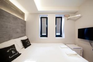 Postel nebo postele na pokoji v ubytování K-Guesthouse Seomyeon 1