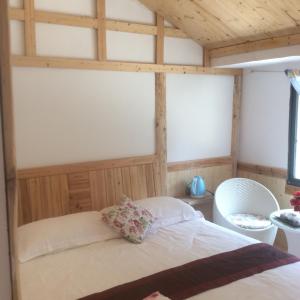 Cama o camas de una habitación en Yangjiajie Inn