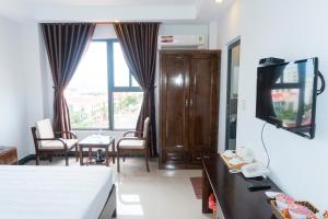 TV a/nebo společenská místnost v ubytování Aries Hotel