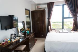 Postel nebo postele na pokoji v ubytování Aries Hotel