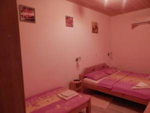 Postel nebo postele na pokoji v ubytování Guesthouse Matija