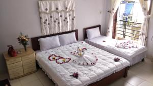 Кровать или кровати в номере Thanh Huong Homestay