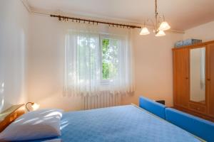 Ein Bett oder Betten in einem Zimmer der Unterkunft Apartments Beba