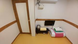 TV a/nebo společenská místnost v ubytování Sohyundang Guesthouse