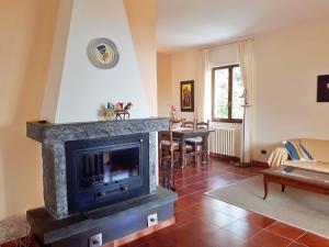 a living room with a fireplace and a table at Villa Grazia in La Spezia